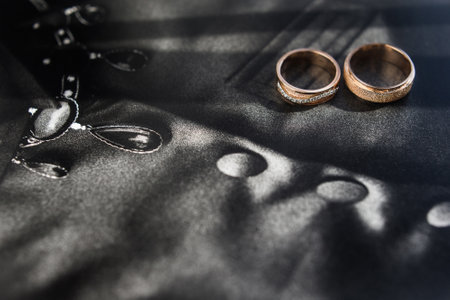 Three wedding rings in a red box.の写真素材