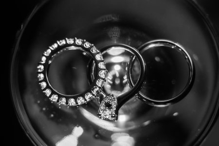 Three wedding rings in a red box.の写真素材