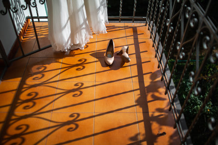 Wedding shoes and dress on the balcony.の写真素材