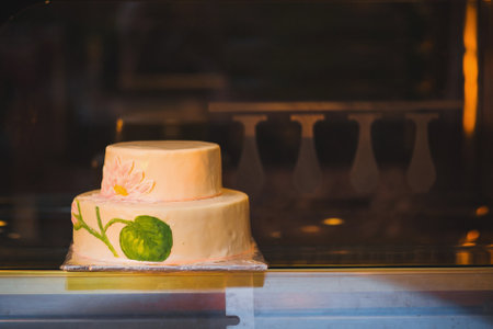 Multilevel wedding cake decorated with flower patterns.の写真素材