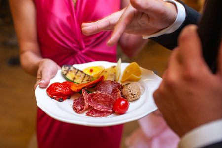 Dish on a round plate at the wedding party.の写真素材