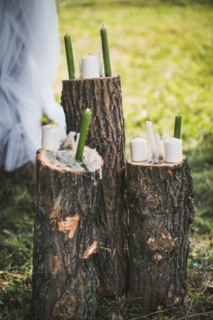 Candles on stumps at the wedding ceremony.の写真素材
