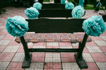 Wooden benches with flowers at the wedding ceremony.の写真素材