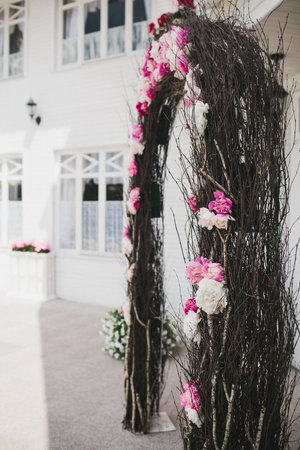 Arch for outdoor wedding ceremony with flowers.の写真素材