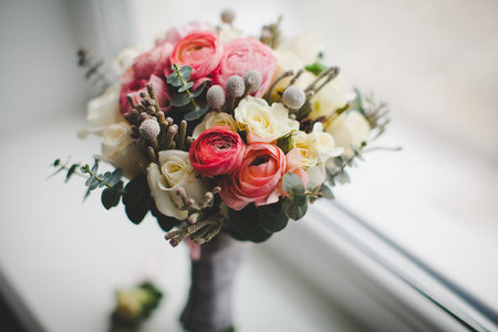 Colorful wedding bouquet on the windowsill in a vase.の写真素材