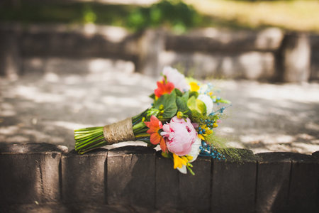 Colorful wedding bouquet on a wooden fence.の写真素材
