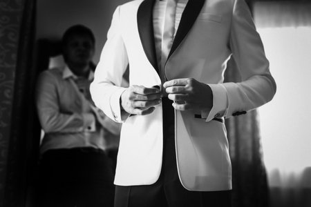 Groom in the morning during wedding preparations.の写真素材