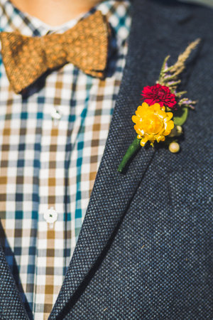 Elegant wedding boutonniere on the groom's suit.の写真素材