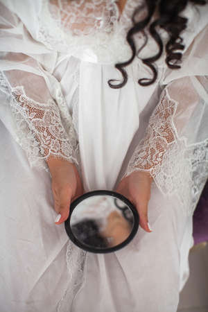 Bride in the morning during wedding preparations.の写真素材