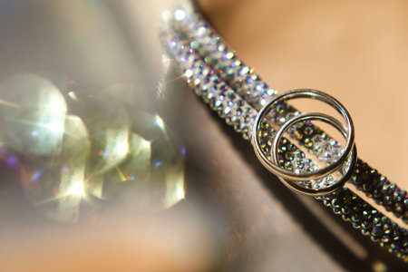 Two golden rings lie on wedding shoes.の写真素材