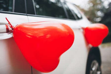 Wedding car decorated with balloons on the door.の写真素材