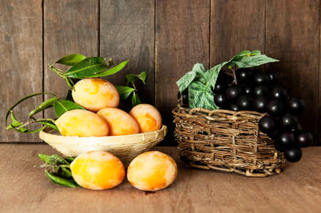 Marian plum or maprang on wood background,grapesの写真素材