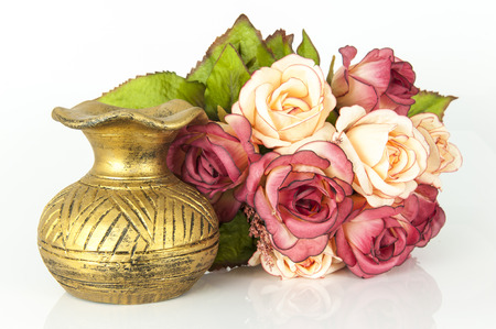Old vase and flower on white background,roseの写真素材