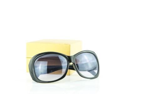 sunglasses and  Yellow gift box on the white backgroundの写真素材