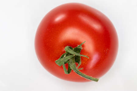 Close up of a ripe and beautiful red tomatoの写真素材