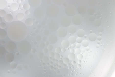 Oil drops in the water create an artistic and imaginatively designed abstract background
