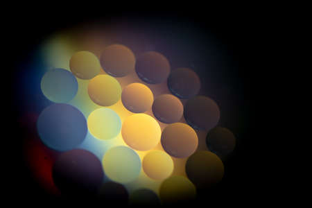 Oil drops in the water create an artistic and imaginatively designed abstract backgroundの写真素材