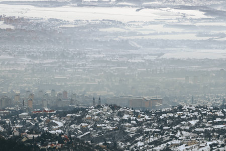 Panoramic view of a town covered with smog in winterの写真素材