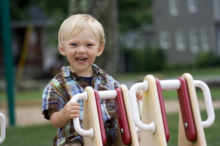 a boy having fun at the parkの写真素材