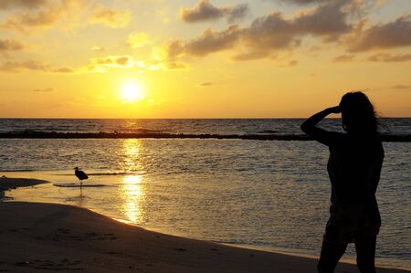 lady figure with sunset background.の写真素材