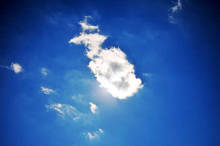 Photo of a cloud in the sky covers the sun at noon