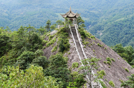 Photo of a traditional Chinese style pavilion in the mountains, Zhejiang Province, Chinaのeditorial素材