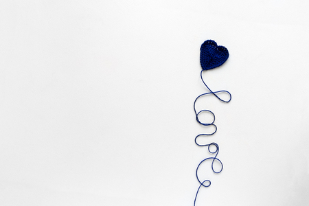 Creative concept. Kate and Love word from blue knitting yarn on white wooden background. Flat lay. Top view. Valentines day celebrationの写真素材