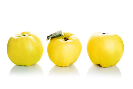 Fresh quinces isolated on white backgroundの写真素材