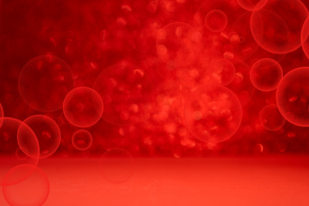 Red background with bokeh. Valentine's day celebration or love concept. Copy spaceの写真素材