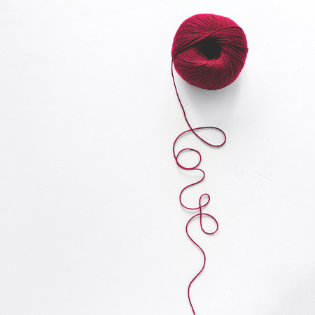Creative concept. Kate and Love word from red knitting yarn on white wooden background. Flat lay. Top view. Valentines day celebrationの写真素材