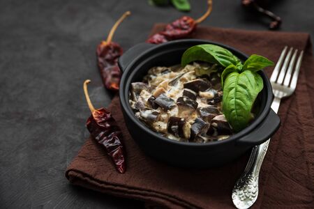 Eggplant curry on dark wooden background. Healthy food conceptの写真素材
