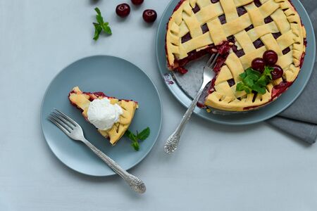 Homemade cherry lattice cake on gray wooden background. Traditional american food. Top viewの写真素材