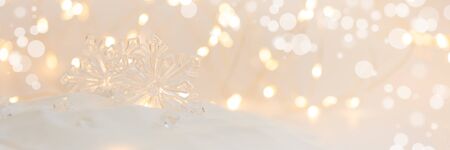 Banner 3:1. Snowflake on defocused lights background. Christmas greating card. Christmas or New Year celebration concept. Copy spaceの写真素材