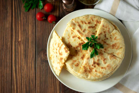 Khachapuri. Georgian traditional dish made from sulguni cheese and bread. Selective focus