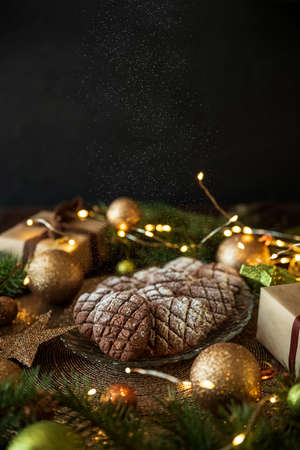 Christmas gingerbread cone cookies with Christmas decorations. New Year and Christmas celebration...