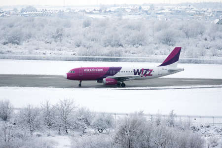 Wizzair airlines plane is getting ready for flight. Lviv, Ukraine - December 03, 2021のeditorial素材