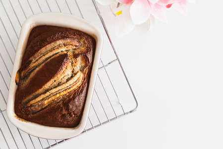 Fresh homemade banana bread on white table. Top view