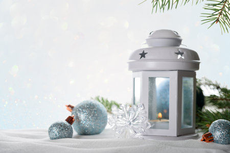 Christmas lantern with decorations on light background. Christmas decorationの写真素材