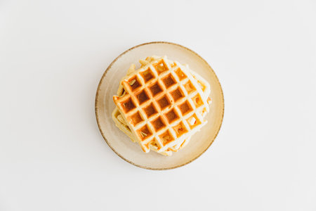 Stack of Belgian waffles on white table. Top viewの写真素材
