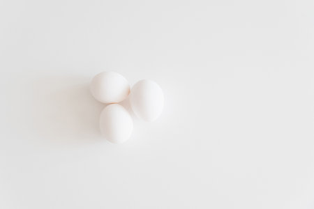 Cooking cake ingredients. Eggs on white table. Copy space. Top viewの写真素材