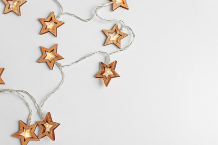 Christmas holidays background with Christmas lights on white background. Top viewの写真素材