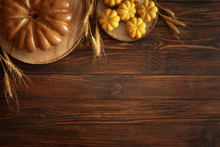 Autumn Harvest Table with Bundt Cake, Pumpkin Cookies and Seasonal Decorの写真素材
