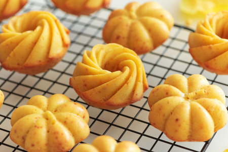 Autumn-Themed Mini pumpkin Cakes with Seasonal Decorations on White Background