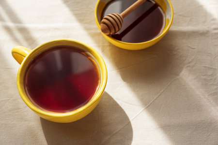 Lemon Tea and Honey on Light Table under Sun Lightの写真素材