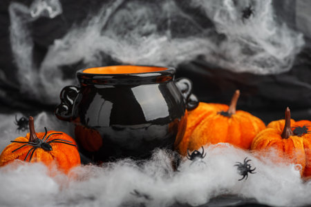 Halloween Cauldron with Pumpkins, Spiders and Cobwebsの写真素材