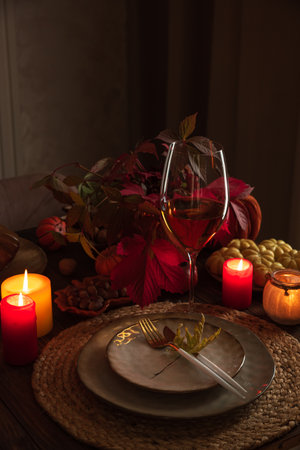 Autumn Table Setting with Pumpkins, Candles and Leaf Decorの写真素材
