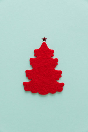 Felt Christmas Tree with Stars on Mint Green Backgroundの写真素材