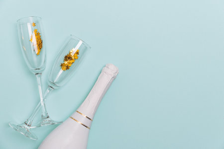 Festive Champagne Celebration with Gold Star Confettiの写真素材