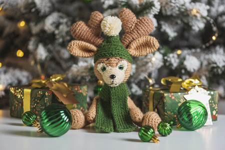 Crocheted Reindeer with Gifts and Christmas Tree in Festive Interior