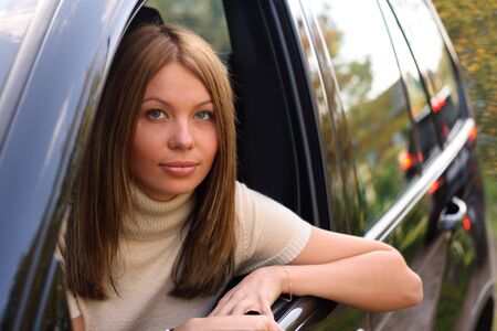 Young woman in Sport Utility Vehicle